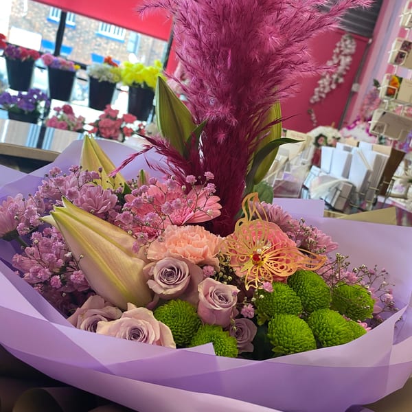 Elegant white flower arrangement with lilies and roses