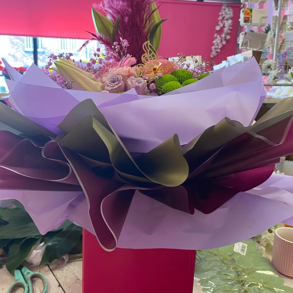 Colourful wildflower bunch wrapped in paper